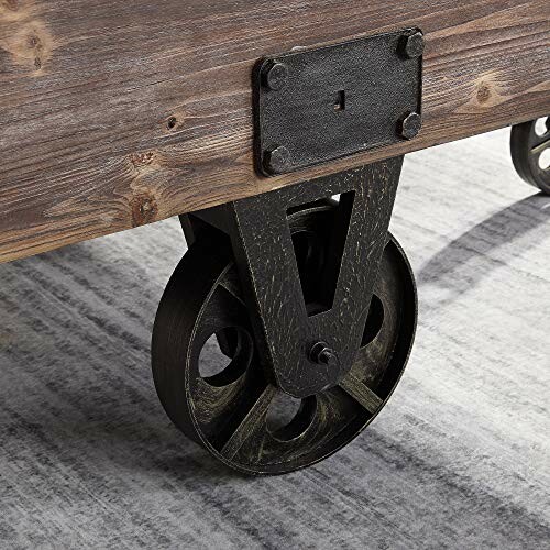 Close-up of a wooden table with metal industrial-style wheels.