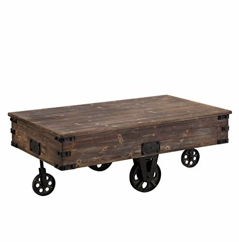 Industrial wood coffee table with metal wheels.